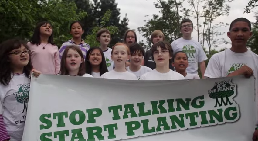 PFTP Ambassadors with "Stop Talking Start Planting" banner